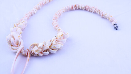 Vintage necklace close-up on a white background, handmade, shells, marine theme, women's accessory, beauty, style, retro, naturalness