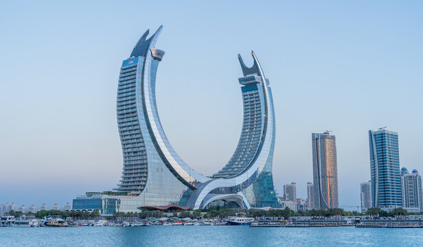 the newly developed lusail city with winter wonderland and crescent tower in the background.