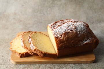 Freshly baked sponge cake on light grey table