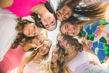 Happy teenagers or childs having fun together on city background
