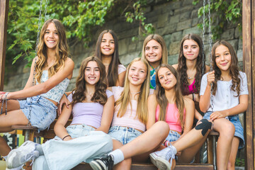 Happy teenagers or childs having fun together on city background