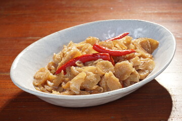 Stir Preserved Radish with coconut milk, vegetarian food, Chinese food. Selective focus and free space for text.