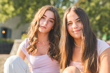 Best friends teen girl embracing each other with smiling