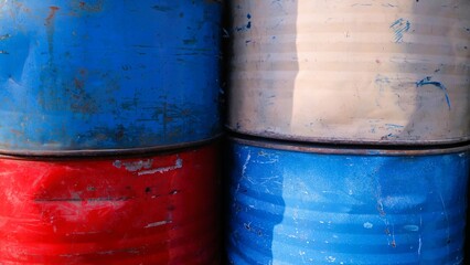 A stack of old aged rusty barrels for vintage background, copy space