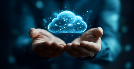 Close-up of man hands holding creative polygonal cloud computing hologram on blue background design with mock-up place. Database and server concept design