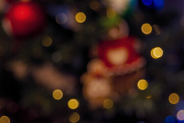 A New Year's garland with rich lights on a dark bokeh background creates a warm and mysterious atmosphere of a magical holiday