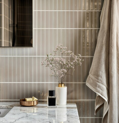 Elegant bathroom with marble countertop and soft decor
