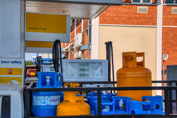 liquified gas bottles, Liquefied Gas Cylinder, at a gas petrol station for refill , next to petrol...