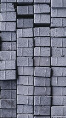  Pile of paving block, grey abstract textured background, copy space
