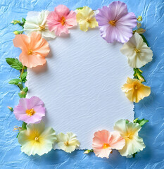 Delicate Pink design and White Flowers Surrounding a White Paper Frame on a Textured Blue Background design