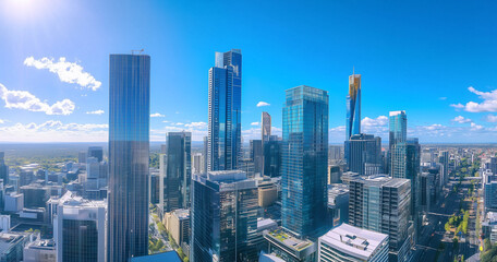 Aerial View of City Skyline and Skyscrapers Under Blue Sky and White Clouds