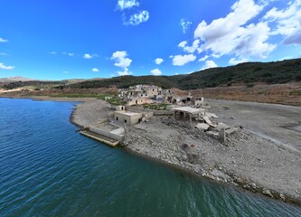 Aerial Drone View of Sfendyli Village by Aposelemi Dam Crete, Greece. High quality photoThis aerial drone photo captures the partially submerged village of Sfendyli near the Aposelemi Dam in Crete