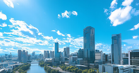 Fototapeta premium Aerial View of City Skyline and Skyscrapers Under Blue Sky and White Clouds