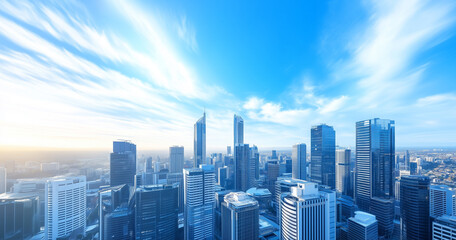 Obraz premium Aerial View of City Skyline and Skyscrapers Under Blue Sky and White Clouds