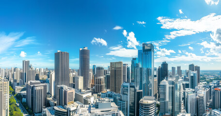 Obraz premium Aerial View of City Skyline and Skyscrapers Under Blue Sky and White Clouds