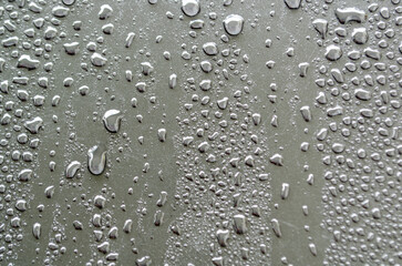 Close up of water droplets on dark cover background. Water or rain droplets and wallpaper design concept