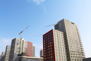 building under construction, construction site with cranes