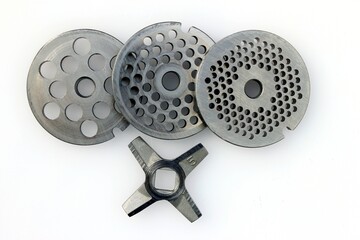 a set of grates and a knife to complete the meat grinder.