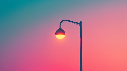 Street lamp against vibrant sunset sky