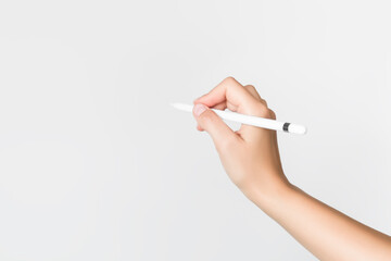 hand holding pad stylus on grey background