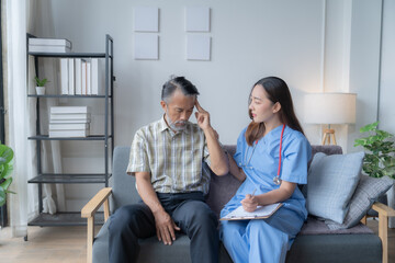 Caring doctor comforts a worried senior patient at home, discussing health concerns with empathy and compassion