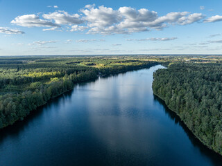 Lake in the Masurian Lake District. Lake Lesk in the Kulka Reserve in Poland. Aerial drone view of  lake surrounded by green forest. Kulka Reserve, Masuria, Poland