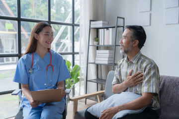 Female doctor smiles warmly while attentively listening to her senior patient during a caring home visit, creating trust and support