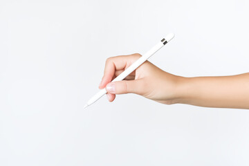 hand holding pad stylus on grey background