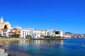 Santa Maria de Cadaqués church and white houses of the beautiful village Cadaqués at the Port Alguer, Girona, Catalonia, Spain