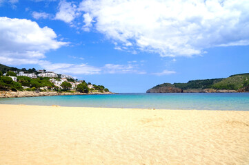 Cala Montgó with white sandy beach Platja de Montgó and beautiful turquoise water of the Mediterranen Sea near L'Escala, Girona, Catalonia, Costa Brava, Spain