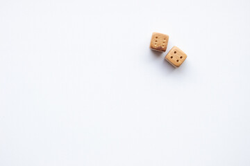 These are photos of wooden dice on a white background. They include shots of aligned, scattered, and stacked dice There are photos of a single die, a pyramid of dice.