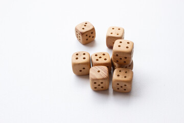 These are photos of wooden dice on a white background. They include shots of aligned, scattered,...