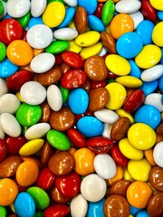 Multicolored dragee candies shot close-up. Background. Texture