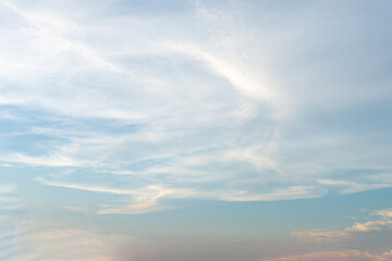 Beautiful blue sky with fluffy white clouds, a breathtaking sunset painting the sky in vibrant hues