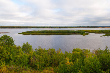 View of Northern Dvina River near the city of Novodvinsk, Arkhangelsk region, Russia. Small islands and forested shores