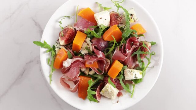 salad with  pumpkin and blue cheese pumpkin on plate food top view