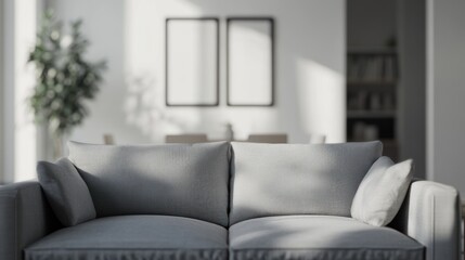 A modern living room featuring a gray couch and minimalistic decor.