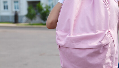 Back to school. cute child girl with backpack going to school
