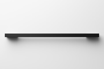 Minimalist black shelf mounted on a white wall in a modern interior design setting