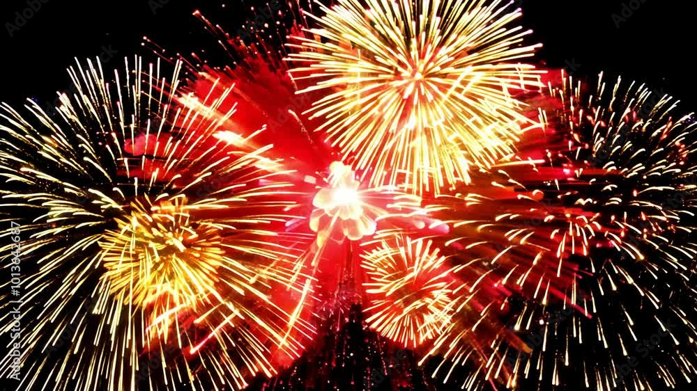 Aufkleber fireworks explode in the night sky, creating a vibrant red display.