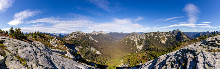 Fototapeta premium Stunning Panoramic View of Mountains in Hope, BC, Canada Under a Clear Blue Sky