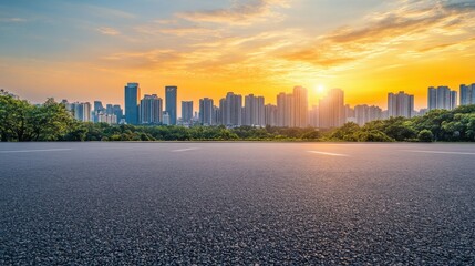 Asphalt road and modern city skyline panorama at sunset