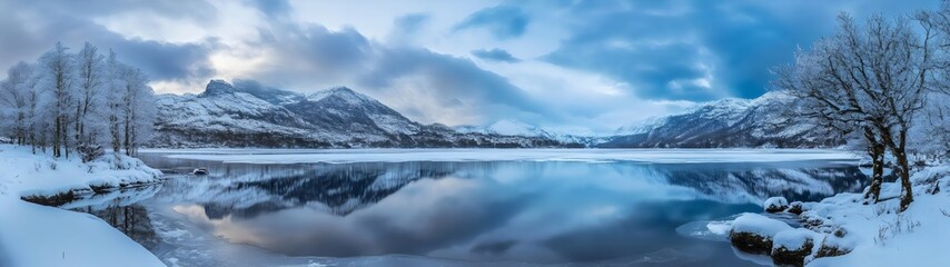 Snowy Mountains Reflected in Frozen Lake
