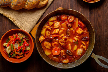 Hala, Cholnt in a pan and tsima on tradition on the table in honor of Rosh Hashan