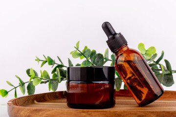 Natural cosmetic cream jar mockup on green leaf background. Makeup product blank container. Body care organic lotion, cleaning scrub. Facial mask, moisturising balm for hair closeup image.