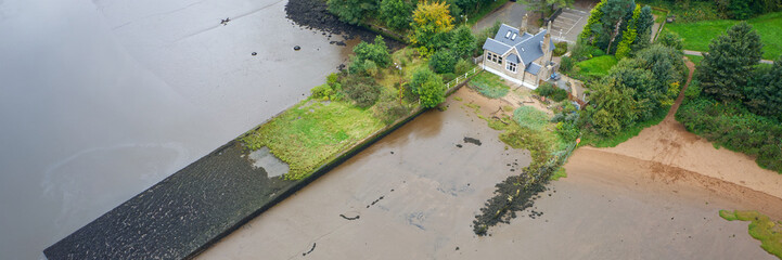 House under the Erskine bridge on the River Clyde