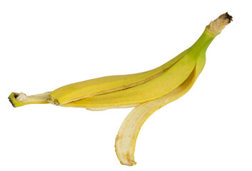 Single banana peel is lying on a white background