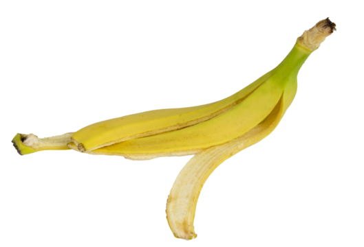 Single banana peel is lying on a white background