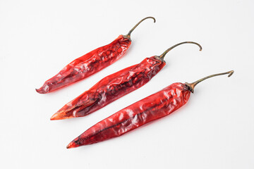 Dried large red chilies for making chili powder or seasoning for various dishes. Isolated on white...