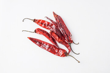 Dried large red chilies for making chili powder or seasoning for various dishes. Isolated on white background
